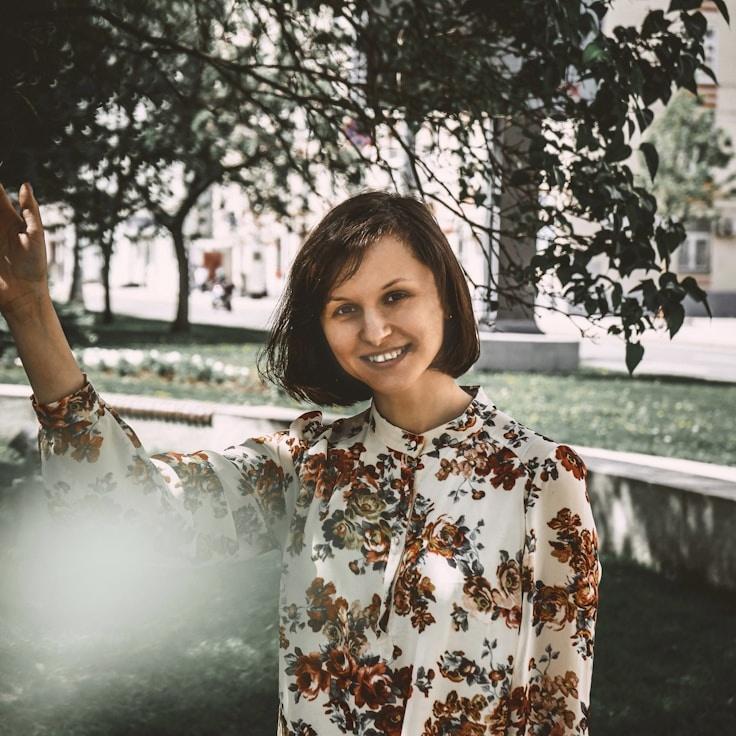 Alex Rivera, Lead Design Curator at RidgeHarborCore, reviewing corporate floral arrangements